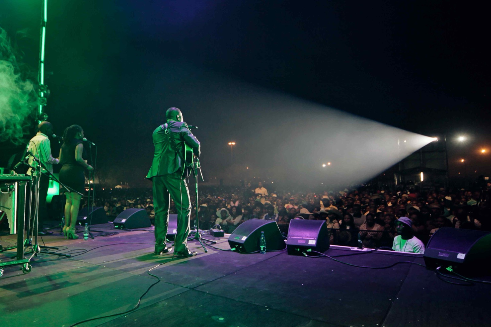 Live concert performance with stage lighting and atmosphere