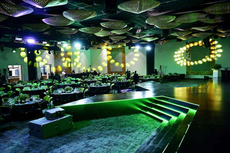 Gala Dinners & Awards featuring elegant table settings, stage lighting, and premium décor