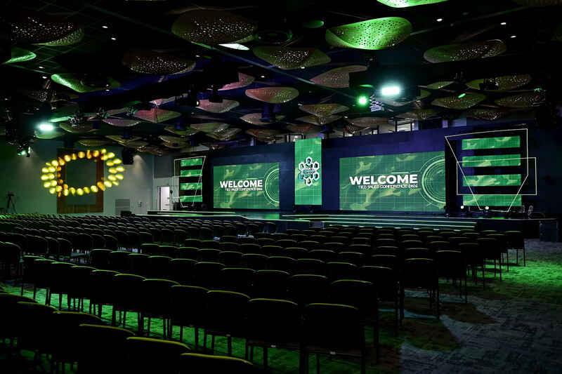 High-profile corporate event showcasing professional conference hall stage and production